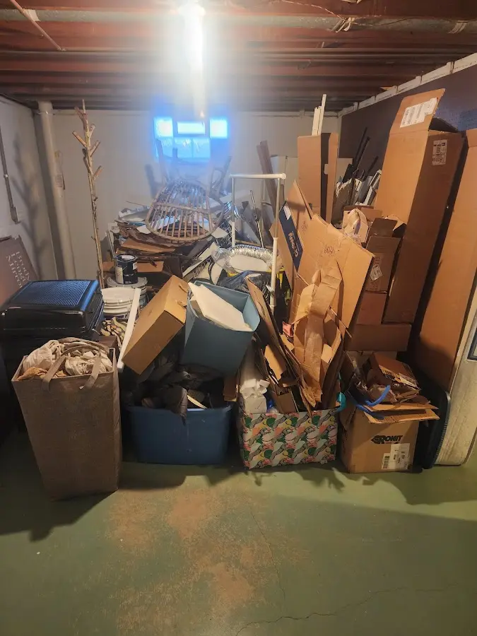 Roll-off dumpster container at job site for Yard Waste Dumpster Rental in Pine Manor